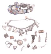 Two silver charm bracelets,