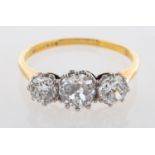 An antique diamond three stone ring.