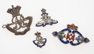 Three brooches comprising; a paste set silver and enamel Royal Artillery brooch,