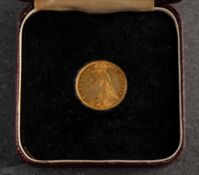 An 1887 Victoria shield back half Sovereign in fitted case.