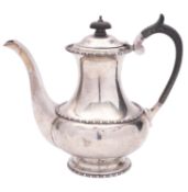A George V silver coffee pot, of baluster form, with a wooden knop finial,