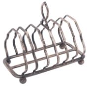 A George V silver toast rack, of rounded rectangular outline, with seven arched bars,