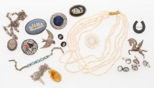 A selection of mostly silver and white metal jewellery in a jewellery box,
