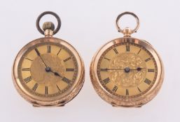 Two 14k gold open face pocket watches, both with engraved decoration,
