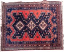 A Hamadan rug, the indigo and brick red