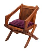 A Victorian 'Glastonbury' chair elbow ch