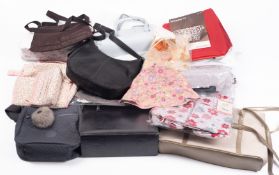 A collection of various handbags includi