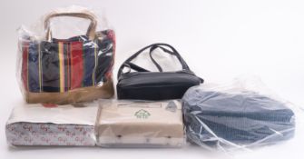 A group of five various handbags. Includ