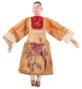 A small Chinese doll, late Qing Dynasty