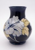 A John Moorcroft pottery vase of baluste