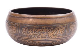 A Tibetan inlaid bronze bowl the interio