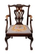 A mahogany and upholstered library elbow
