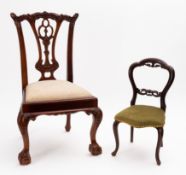 A carved and stained hardwood child's ch