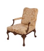 A carved beech wood open armchair of Gai