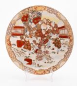 A Satsuma earthenware charger decorated