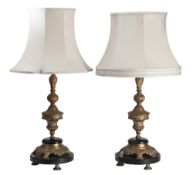 A pair of metal and black marble mounted