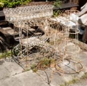 Two similar white-painted wirework plant