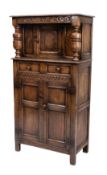 A 17th Century style oak court cupboard