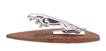 Jaguar Cars, a chromed metal leaping jaguar bonnet mascot, mounted onto a rectangular slate plinth,