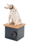 A carved and painted wood mechanical model of a Dalmatian hound,