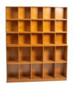 An oak sectional open bookcase by Unix.