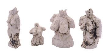 Four white stoneware maquettes of female torsos, some copper staining,