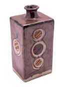 A Mingei [Mashiko] stoneware bottle vase of shouldered rectangular form decorated with brightly