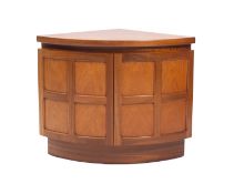 A teak corner cupboard of small size by Nathan, mid 20th Century.