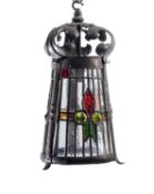 An Arts & Crafts copper and coloured glass ceiling lantern,