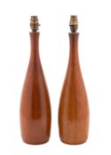 A pair of turned and stained hardwood table lamps, circa 1960s; of bottle form,