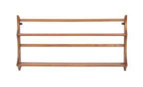 A blonde elm plate rack by Ercol, mid 20th Century.