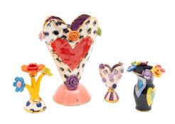 *Mary Rose Young [b 1958] four pieces of flower studded pottery comprising two heart vases,