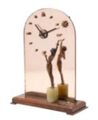 A Continental mirrored glass and walnut mounted mantel clock in Art Deco style,