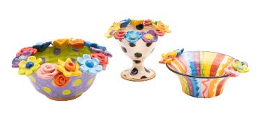 *Mary Rose Young [b 1958] three flower studded bowls each brightly glazed,