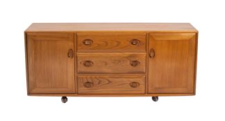A blonde elm 'Windsor' sideboard by Ercol, mid 20th Century.