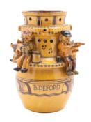 Harry Juniper [b 1947] a terracotta puzzle jug slip and sgraffito decorated with Bideford long
