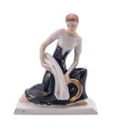 A Royal Dux Art Deco figure of a female harvester modelled after the original by Elly Strobach