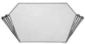An Art Deco metal framed wall mirror, circa mid 1930s; of irregular hexagonal outline,