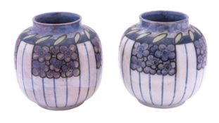 A pair of Royal Doulton stoneware vases painted with panels of stylised blooms on a linear ground,