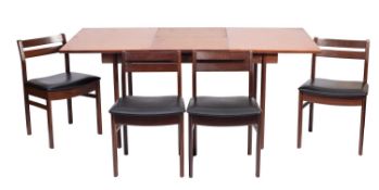 A stained hardwood extending dining table and four chairs, mid 20th Century.