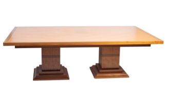 A walnut twin pedestal dining table, modern.