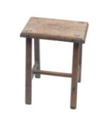 A painted fruitwood stool, early 20th Century.