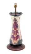 A John Moorcroft pottery table lamp tube lined in the Foxglove pattern after a design by Rachel