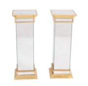 A pair of brass and mirrored pedestals in Doric style, late 20th Century.