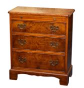 A walnut veneered Bachelors chest in Reg