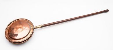 A copper and brass mounted bed warming p