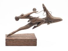 A carved wood and copper wire sculpture