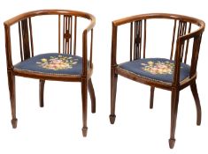 A pair of Edwardian mahogany and inlaid tub chairs, circa 1910.