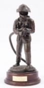 A 20th Century cast resin figure of a fi