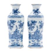 A pair of Dutch Delft pottery flasks of shouldered hexagonal form painted in blue with a Chinese